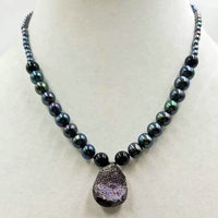 Past Work. Druzy quartz necklace, black pearl, onyx, with 14KWG clasp.  Hand-knotted witwith purple silk. 17.5" length. Sold.