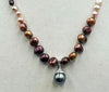 Gorgeous, coppery pearls! Ombre multi-colored fresh-water cultured pearls & sterling silver pendant. 22" length.
