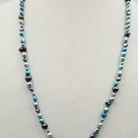 Past Work. Beautiful multi-color fresh-water cultured pearls on hand-knotted crimson silk. 28" length. Sold.