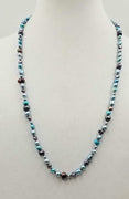 Past Work. Beautiful multi-color fresh-water cultured pearls on hand-knotted crimson silk. 28" length. Sold.