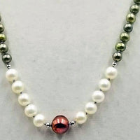 Gorgeous. Fresh-water, cultured pearls, sterling silver necklace, hand-knotted with lavender silk. 26" length.