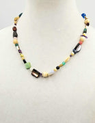 14K Yellow Gold, multi-stone necklace on green silk.