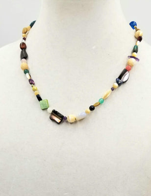 14K Yellow Gold, multi-stone necklace on green silk.