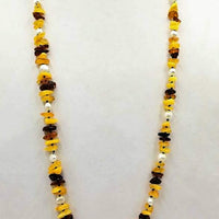 Baltic amber & pearl rope necklace on navy silk.  36" Length.