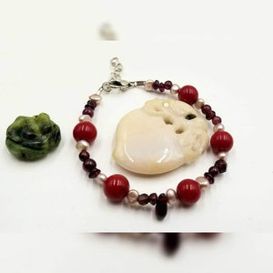 Past Work. Adjustable, sterling silver, pearl,coral,  & garnet bracelet.6.5-7.5" Length. Sold