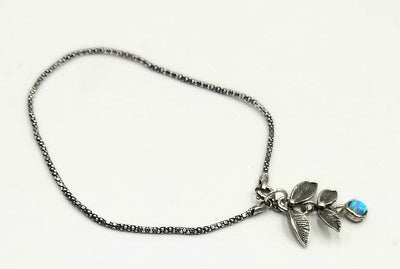 Sterling silver, lab opal, charm bracelet. 7.5