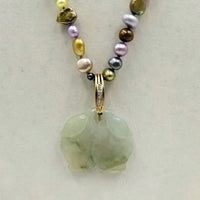 14K Yellow Gold, multi-color pearl necklace with diamond jadeite pendant on lavender silk.
