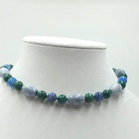 Sterling silver, azurite, marble,and malachite necklace on verde silk. 13" Length.