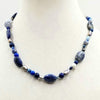 Sterling silver, lapis lazuli, pearl, jasper, marble, chalcedony necklace on verde silk.  20" Length