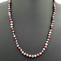 14KYG, matinee length, black & red pearl necklace on white silk. 24"