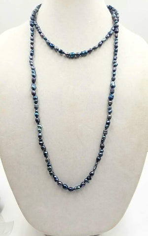 Past Work. Rope of black and blackish blue pearls.