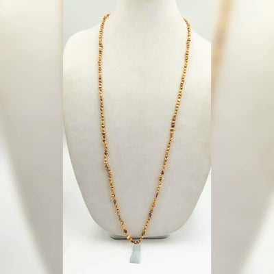 Golden pearls on sky blue silk with jadeite hand pendant.  38.5
