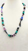 Past Work. Sterling silver, onyx, abalone, chalcedony, howlite, hematite, art glass necklace. 26" Length. Sold.