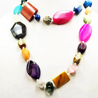 Past Works. Bold, multi-stone & pearl, rope necklace on white silk. 43" Length. Sold.