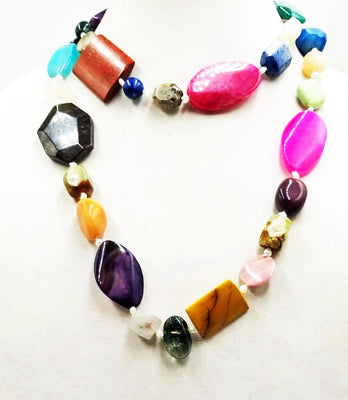 Past Works. Bold, multi-stone & pearl, rope necklace on white silk. 43