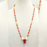 Bi-tone coral,  golden fresh-water cultured pearls, on lavender silk with sterling silver clasp. 28" Length.