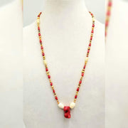 PRICE REDUCED Bi-tone coral,  golden fresh-water cultured pearls, on lavender silk with sterling silver clasp. 28" Length.