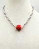 Silvery pearls on crimson silk, with coral and nephrite jade focal & sterling silver clasp. 18.25" Length.