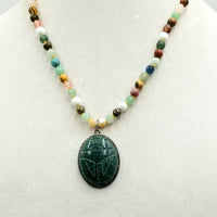 Sterling silver, multi-stone, multi-color aventurine Scarab necklace on canary yellow silk. 19.25" Length.