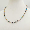 Sterling silver, multi-stone, delicate necklace on rose silk.