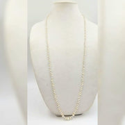PRICE REDUCED Rope of cultured freshwater pearls on rose silk.