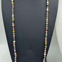 Very Long, multi-color rope, pearls, individually knotted on silk. Could be used as a head band also.