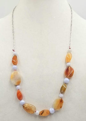Sterling silver, bi-tone agate necklace on rose silk. 28