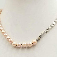 Past Work. Adjustable, Sterling Silver & beige pearl necklace on chocolate silk. 16.5" - 19.25"