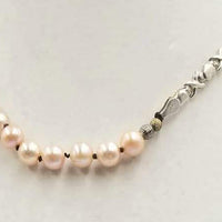 Past Work. Adjustable, Sterling Silver & beige pearl necklace on chocolate silk. 16.5" - 19.25"