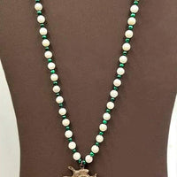 A Beautiful 19.5" necklace of Malachite & MOP, a sterling Swarovski clasp & a Rose Gold-plated spiral pendant.