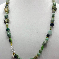 Beautiful long necklace made of sterling silver & various green stones.