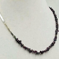 Past Work. Unisex, sterling silver & garnet streetwear fashion necklace on moss green silk. 20.5" Sold