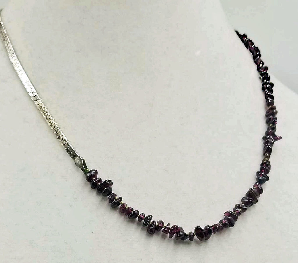Past Work. Unisex, sterling silver & garnet streetwear fashion necklace on moss green silk. 20.5" Sold