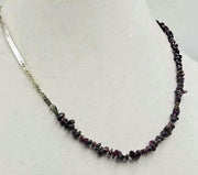 Past Work. Unisex, sterling silver & garnet streetwear fashion necklace on moss green silk. 20.5" Sold