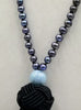 Exquisite Peacock pearl mala necklace on black silk with aquamarine guru bead.
