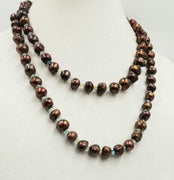 PRICE REDUCED! Dazzling & delightful gift. This art piece is made of re-claimed bronze baroque pearls & faceted aquamarines.This rope necklace is strung on Canary yellow silk. 43" Length