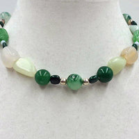 Pretty necklace of jadeite, malachite, chalcedony, nephrite & sterling silver toggle.