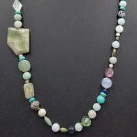 PRICE REDUCED Beautiful statement piece. Turquoise colored stones & sterling silver beads are stunning.