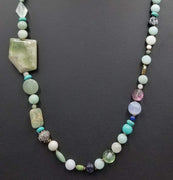 PRICE REDUCED Beautiful statement piece. Turquoise colored stones & sterling silver beads are stunning.