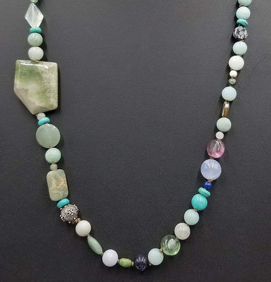 Beautiful statement piece. Turquoise colored stones & sterling silver beads are stunning.