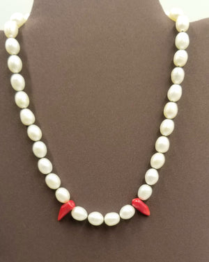 Past Work "Little Fang" a darling goth necklace of Sterling silver, pearl, & red coral on hand-knotted brown silk. 17" Length. Sold