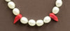 Past Work "Little Fang" a darling goth necklace of Sterling silver, pearl, & red coral on hand-knotted brown silk. 17" Length. Sold
