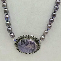 Baroque peacock pearls, sterling silver & sugilite pendant, hand-knotted necklace on lilac silk.  35" Length.