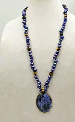 Indigo dyed freshwater cultured pearls & tiger's eye necklace with brass sodalite pendant with hand-knotted coppertone silk.