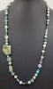 PRICE REDUCED Beautiful statement piece. Turquoise colored stones & sterling silver beads are stunning.