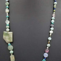 PRICE REDUCED Beautiful statement piece. Turquoise colored stones & sterling silver beads are stunning.