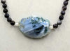 Stunningly gorgous sterling silver, Mother of Pearl & blue agate necklace on coppertone silk.  25.25"