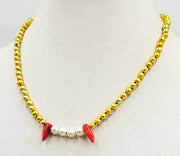 Golden pearl, coral &  sterling silver fang necklace on crimson silk. 20" Length.