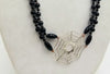 "Black Widow" A long, two-strand, onyx & sterling silver spiderweb necklace with smoky quartz accents on hand-knotted coppertone silk. 34" Length.