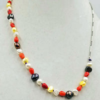 Past Work. Like Halloween Candy?  Coral, multi-colored freshwater cultured pearls, & sterling silver,  unisex necklace with hand-knotted purple silk. 21" Length. Sold.